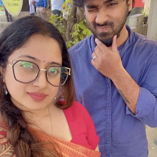 Sneha and Chan pulling faces in a street selfie